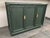 Vintage 1970s, faux bamboo, wooden sideboard, newly painted in glamorous studio green. The buffet has 2 doors flanking a...