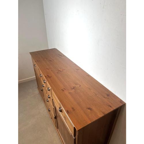 Charming solid pine sideboard with a warm honey tone and classic country look. This spacious cabinet features a practical...