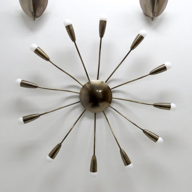 wonderful aged brass twelve light Aura-38™ Flushmount Light designed by Gallery L7, handcrafted and finished in Los...