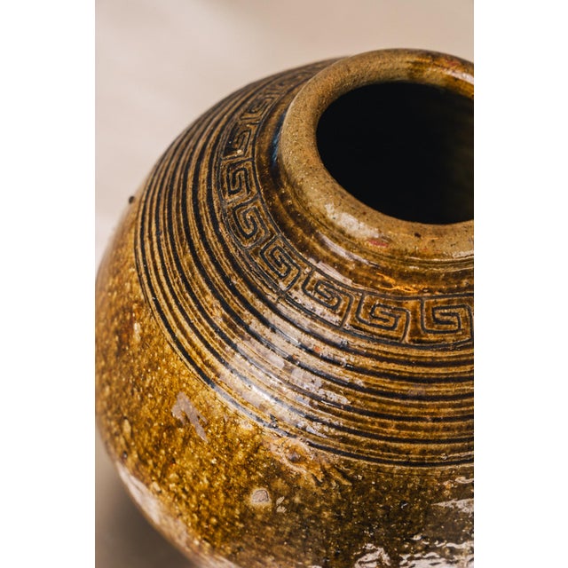 This vintage Chinese martaban is a stunning example of traditional glazed stoneware, featuring a beautiful geometric...