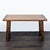 This Pottery Barn desk has a solid wood top and sturdy wooden legs, featuring strong metal accents for a rustic look. The...