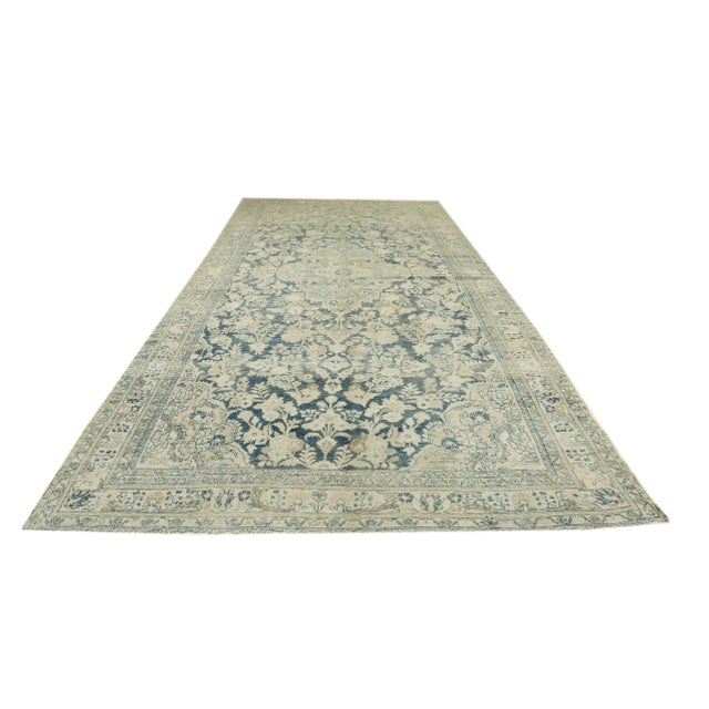 Washed out vintage handknotted wool Persian Tabriz rug. Approximately 55-65 years old. In very good condition.