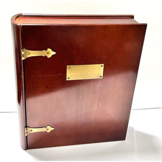A handsome vintage Bombay Company storage box designed to resemble an oversized leather-bound book. The warm brown finish,...