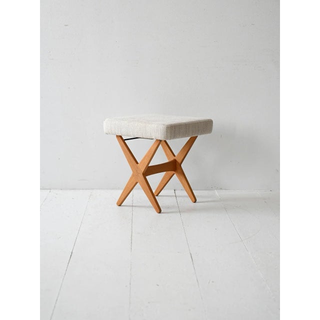 Vintage Scandinavian oak footstool, 1960s, by Alf Svensson, with cross-legged legs and new fabric upholstery. Vintage...
