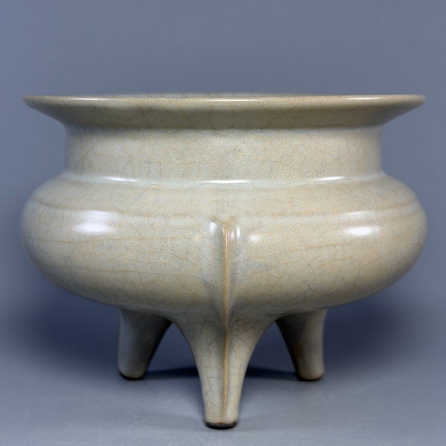 Antique Chinese Guan‑style porcelain tripod censer, once used for royal court. Classic natural crackle glaze, elegant...