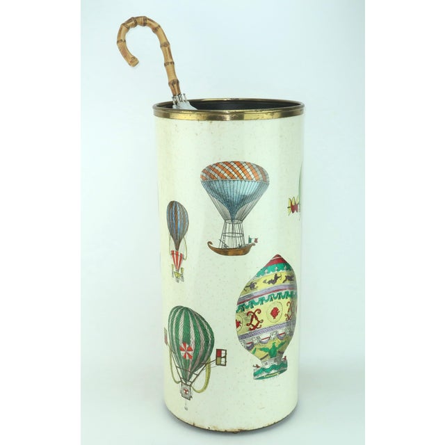 From the creative mind of Piero Fornasetti...a whimsical 1950's enameled metal umbrella stand with a colorful lithographed...
