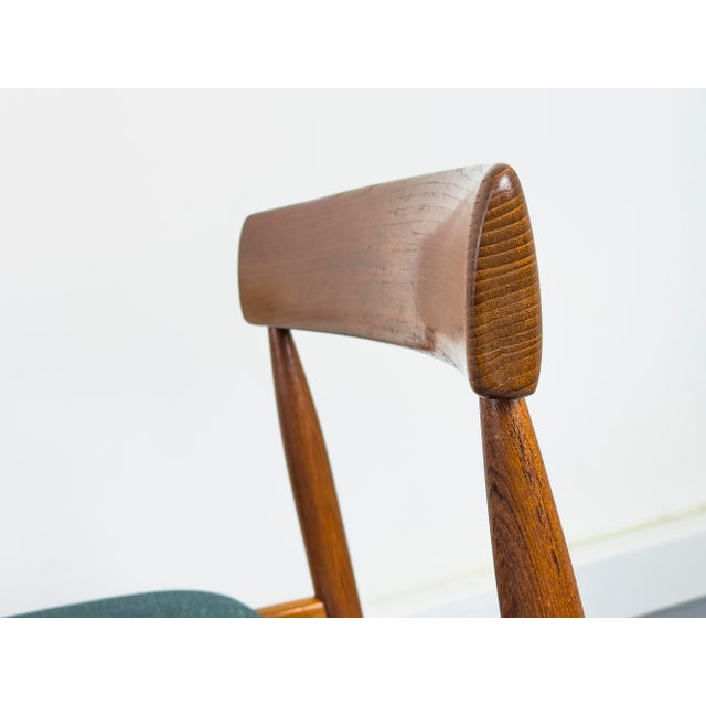 High-quality, delicate dining chairs made of solid teak with curved backrests, manufactured in Denmark. The seat cushions...