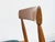 High-quality, delicate dining chairs made of solid teak with curved backrests, manufactured in Denmark. The seat cushions...