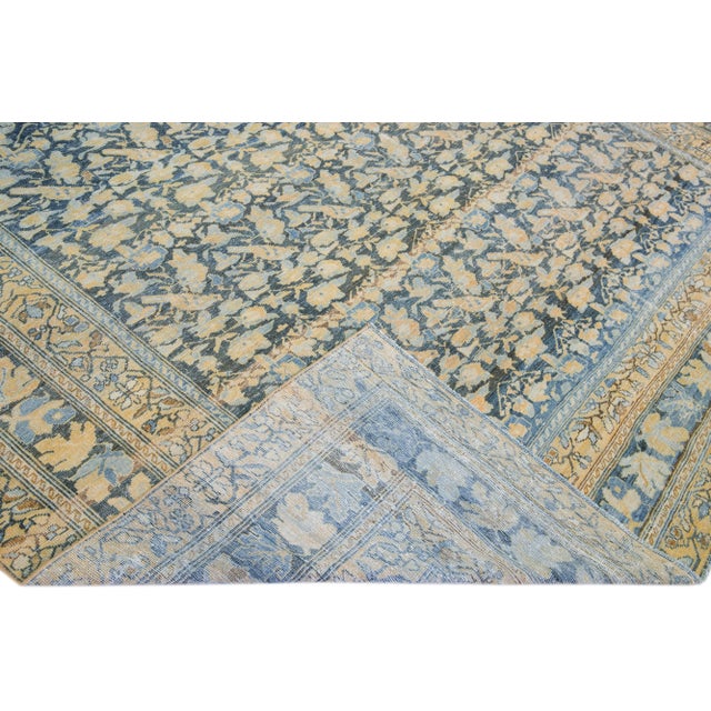 Beautiful Antique Sarouk Farahan hand-knotted wool rug with a blue field. This Persian rug has multi-color accents on a...