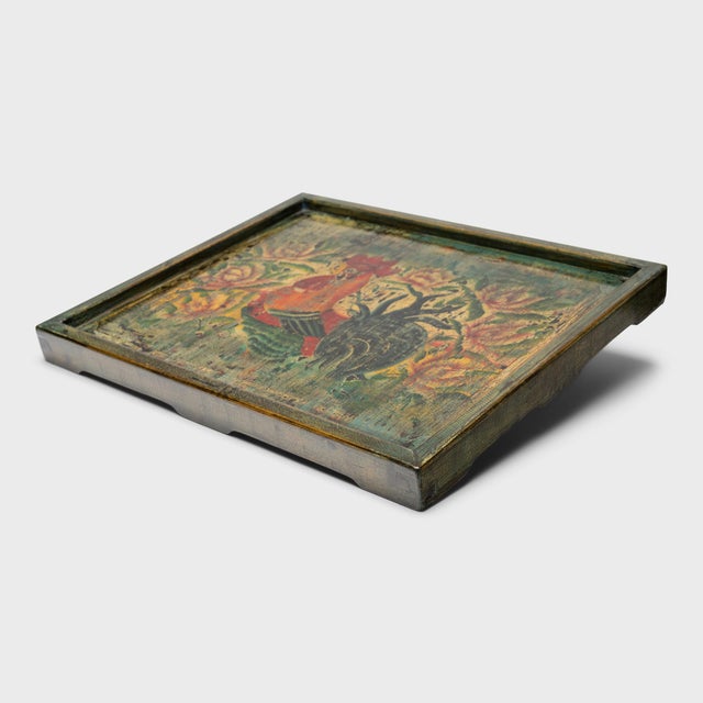 This lacquered serving tray is crafted with a hand-painted panel salvaged from a vintage Chinese cabinet. Selected for its...
