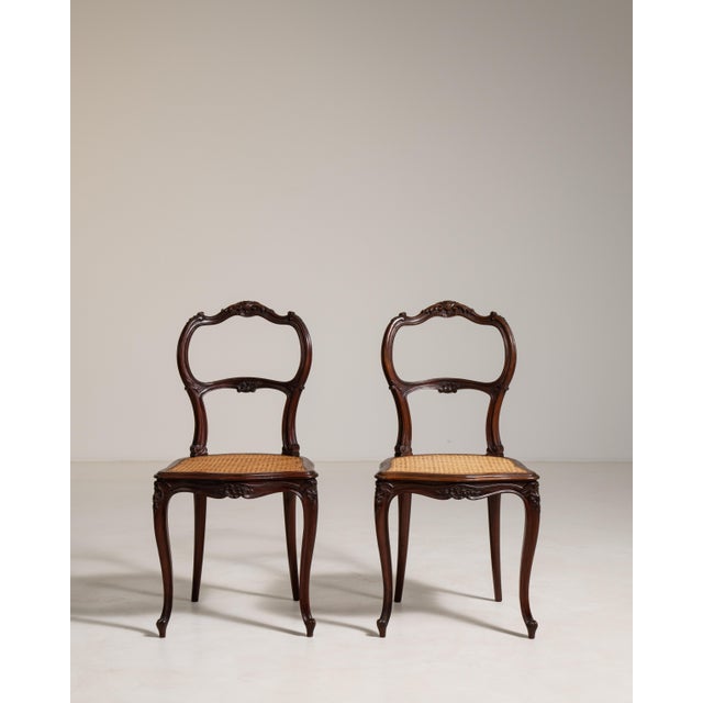 Rendered in warm bamboo with the graceful restraint characteristic of the Louis Philippe period, this distinguished pair...