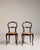 Rendered in warm bamboo with the graceful restraint characteristic of the Louis Philippe period, this distinguished pair...