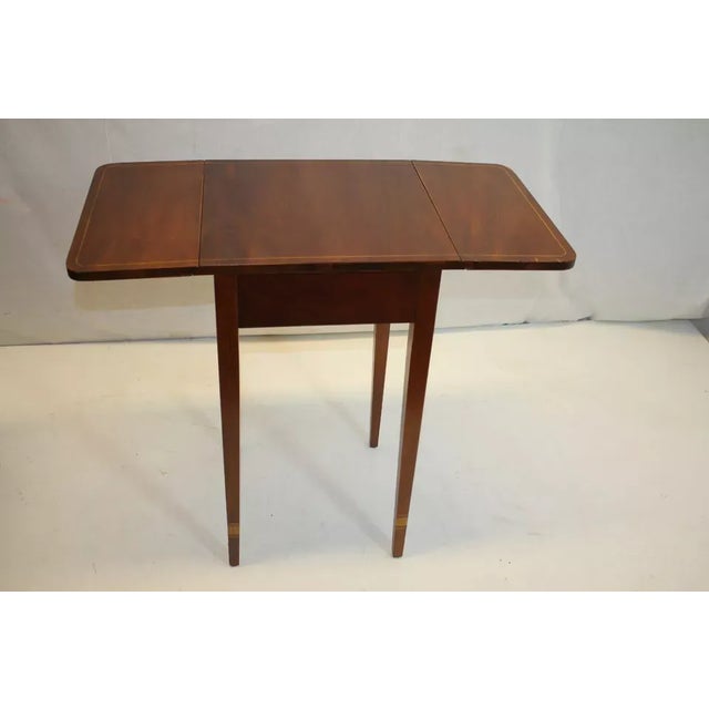 Exceptional sheraton style inlaid drop leaf work side table, circa 1920's, featuring drop down leaves above one drawer...