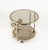 Midcentury amazing three-wheeled round serving bar cart in brass, chrome and smoked glass with Bottle Holder. Made in...