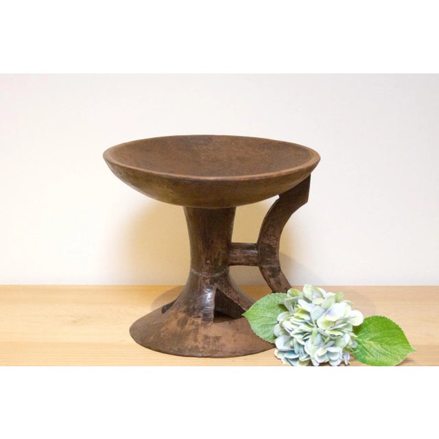 A vintage tribal Naga small side table, hailing from the enchanting tribal region of Nagaland in North Eastern India,...