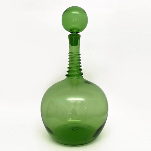 This Vintage Blenko Green Decanter, by Joel Philip Myers, has a spiral coil. Joel Philip Myers graduated with honors from...
