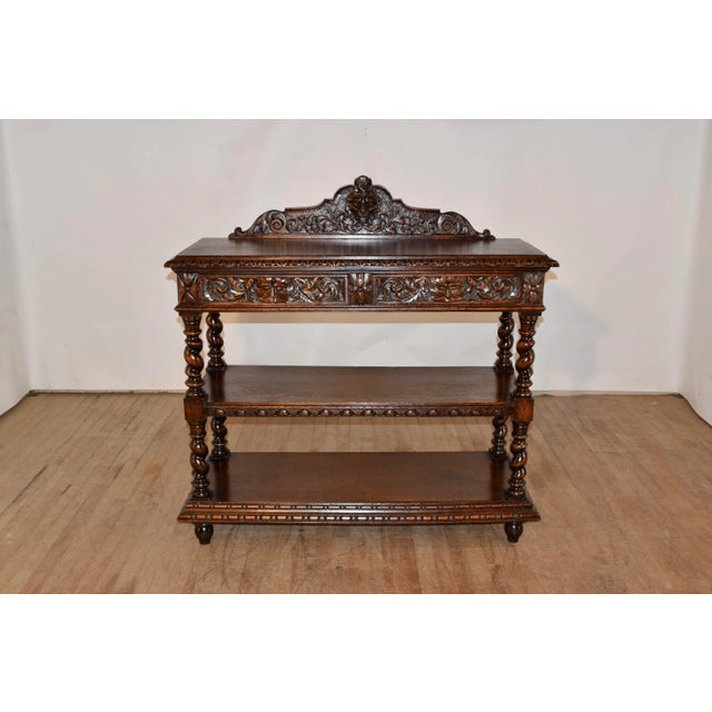 19th century oak dessert buffet from France with a lovely detailed hand carved and scalloped backsplash, over three...