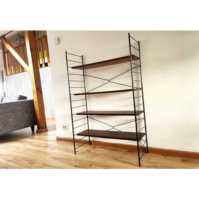 We present an absolute classic of post-war modernism: the iconic "string" ladder-style shelving unit, dating from the...