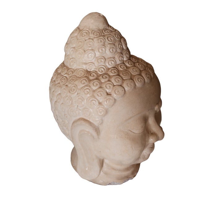 Infuse your space with serene elegance and spiritual grace with this remarkable porcelain Buddha head statue. A masterful...