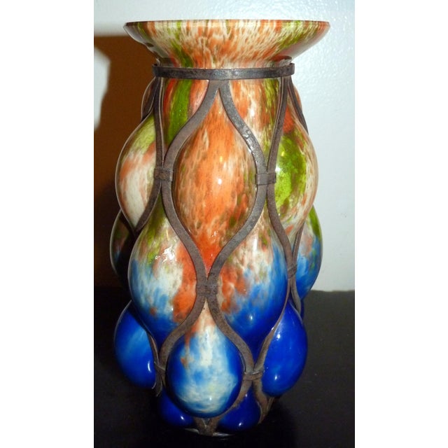 A magnificent example of interwar Bohemian artistry, this large 10-inch "caged" or "imprisoned" art glass vase was...