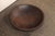 A Sumatran hand-carved wooden bowl from the early 20th century. This antique bowl from Sumatra has been masterfully hand-...