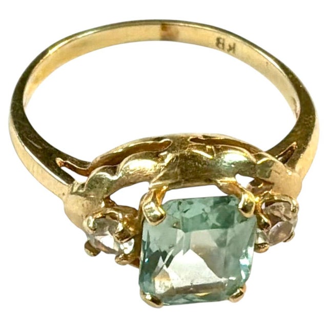 Vintage 18K Yellow Gold, Tourmaline and White Topaz Cocktail Ring. The ring centers on a beautifully colored rectangular...