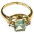 Vintage 18K Yellow Gold, Tourmaline and White Topaz Cocktail Ring. The ring centers on a beautifully colored rectangular...