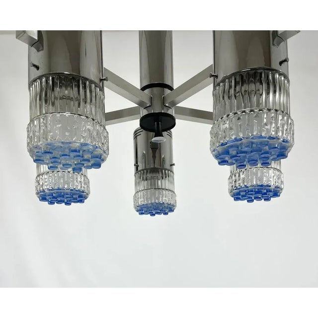Italian space age chandelier with five lights The structure is in chromed metal with five glass globes The under part of...