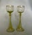 An elegant pair of antique römer wine glasses in delicate pistachio-green glass, with rounded bowls poised above...