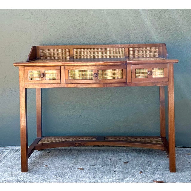This exquisite vintage writing desk seamlessly blends the organic warmth of teak wood with the intricate texture of hand-...