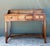 This exquisite vintage writing desk seamlessly blends the organic warmth of teak wood with the intricate texture of hand-...