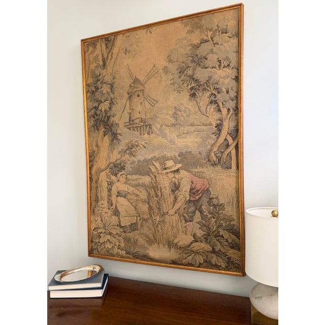 Mid-century French jacquard-woven tapestry depicting a pastoral harvest scene with windmill landscape, presented in a...