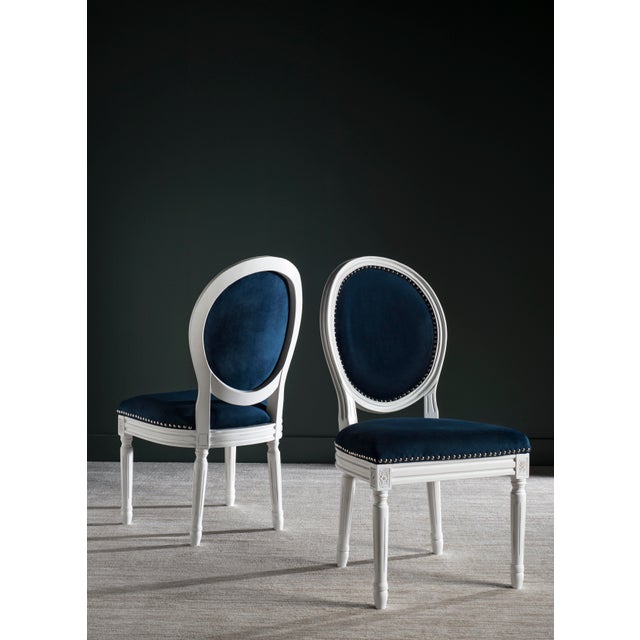 Brim With French country charm, this set of two dining chairs boasts a classic cream frame, navy velvet upholstery and...