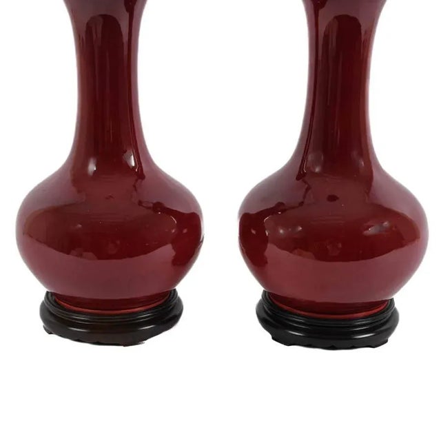 Mid 20th Century Pair of Mid-Century Oxblood Sang De Boeuf Chinese Porcelain Vase Lamps With Brass Double Sockets, Circa 1950s For Sale - Image 5 of 8