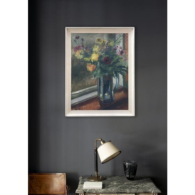 A good impressionist oil on canvas of flowers in a glass vase on a window sill. Dates to Mid 20th Century, signed WS This...