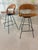Two rare rotating, counter height stools by Arthur Umanoff. These stools are thoughtfully crafted with a steel frame,...