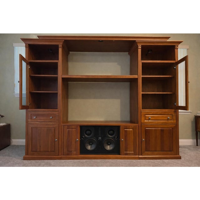 A Baker Road Cherry Home Theater Center for 55" TV. High end construction with plywood core. It has solid cherry doors,...