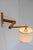 A classic mid-century modern scandinavian accordion wall lamp with a folding swing arm from ikea, crafted in pine and...