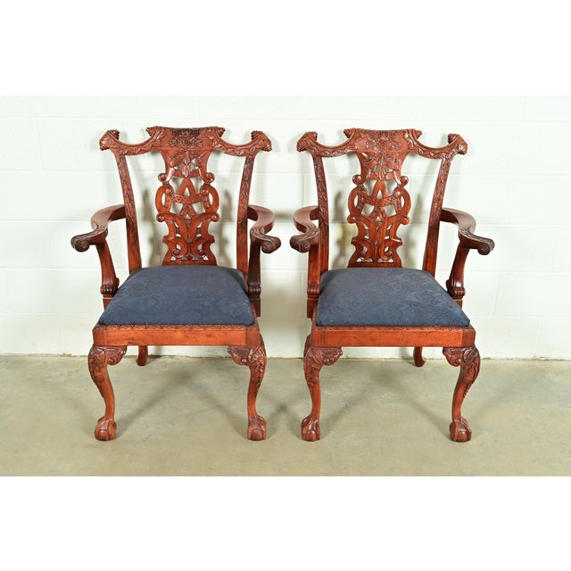 An outstanding pair of Chippendale or Georgian style armchairs or dining captain chairs In the manner of Baker Furniture...