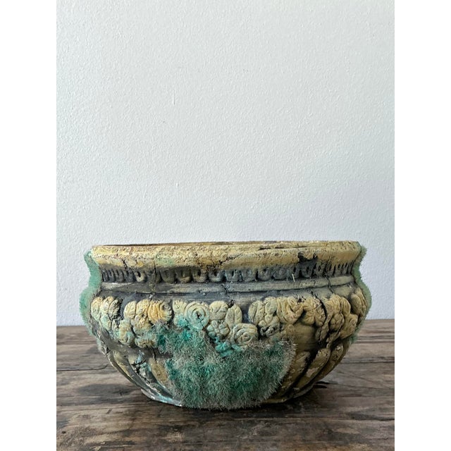 This exquisite vintage planter is a masterclass in Neoclassical garden design, featuring a romantic floral relief of...