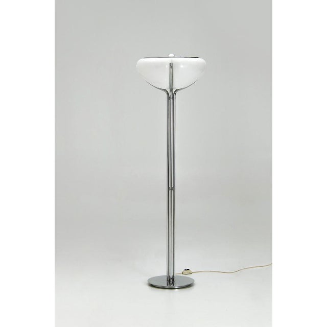 This Italian floor lamp from the 1970s is a production by Harvey Guzzini, credited to their internal design department,...