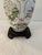 Lovely vintage Asian ceramic table lamp featuring a botanical motif around perimeter with dark brown hard molded resin...