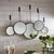 This bold set of 5 mirrors are a great way to add interest and dimension to a room. The matte antique black finish and...