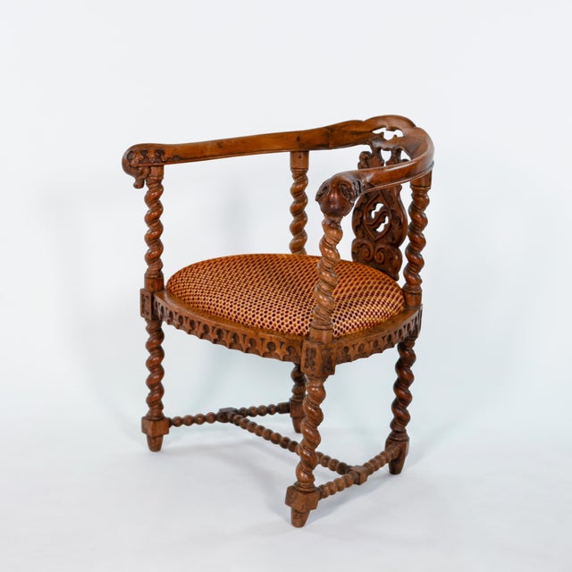 Gothic Revival yew tub chair with continuous curved top rail above a pierced foliate back splat carved with strapwork and...