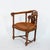 Gothic Revival yew tub chair with continuous curved top rail above a pierced foliate back splat carved with strapwork and...