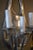Pair of polished aluminium sconces with three lights.
