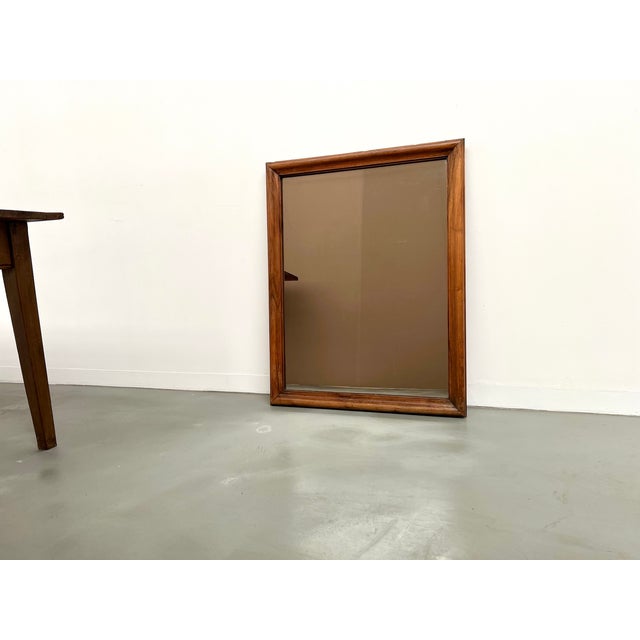 Maison Lecan presents this charming 1900s period mirror in solid walnut with a warm and even grain. The understated frame,...