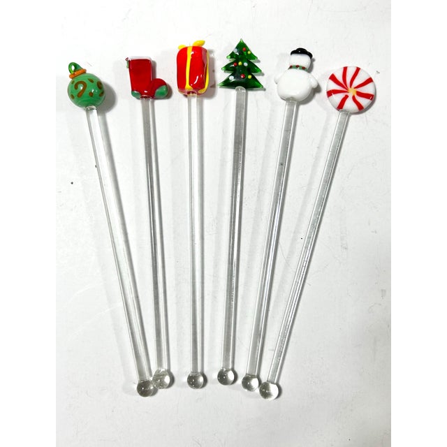 Vintage blown glass Christmas swizzle sticks, set of six, featuring an ornament, stocking, gift, Christmas tree, snowman,...