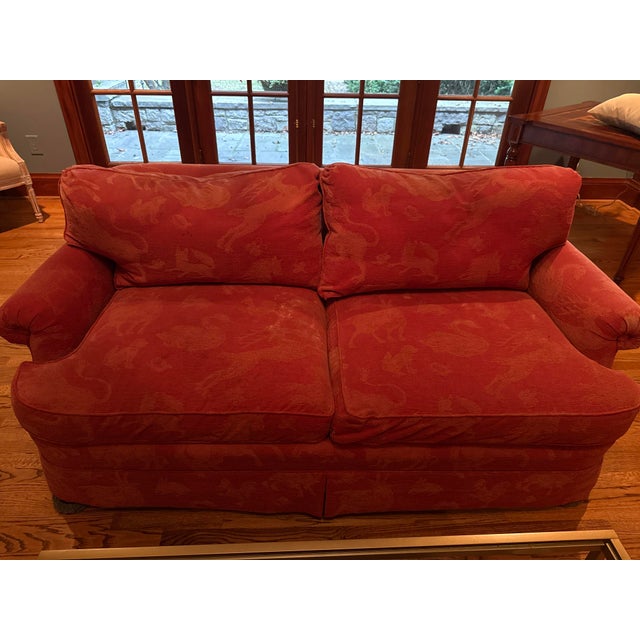 Well built luxury love seats. Covered in an animal print in a rich deep reddish mauve fabric. Very well kept with a non...