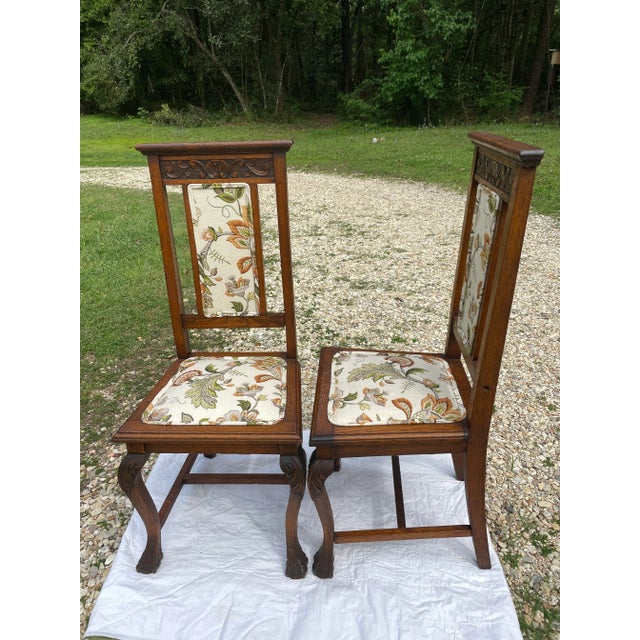 This pair of Jacobean carved oak side chairs was probably part of a set of dining chairs long ago. Our guess is that they...